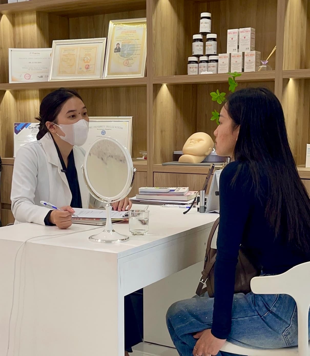 A client receiving a dermatology consultation at Eternal Beauty Center